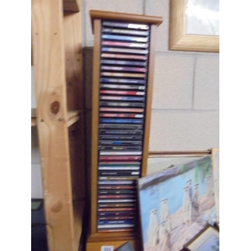 504 - A CD stand and a mixed lot of CD's. COLLECT ONLY.