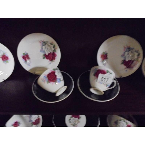 517 - A Queen Anne bone china tea set decorated with roses.