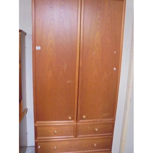 525 - A teak drawer base wardrobe. COLLECT ONLY.