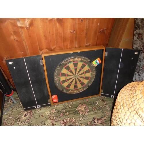 531 - A cased dart board.