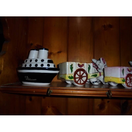 545 - A mixed lot of ceramics including ship salt and pepper.