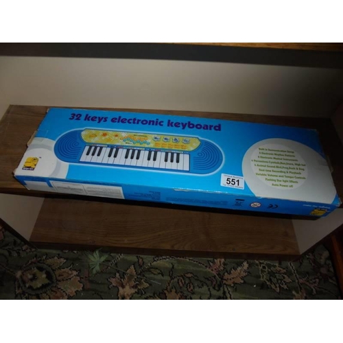 551 - A boxed child's keyboard.