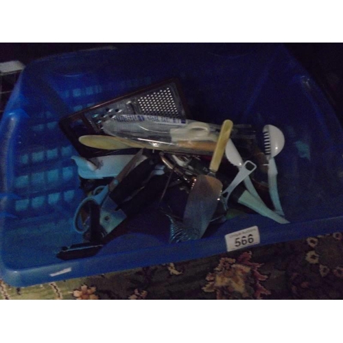 566 - A box of kitchen utensils.