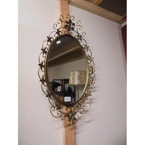 573 - A vintage wrought iron framed mirror. COLLECT ONLY.