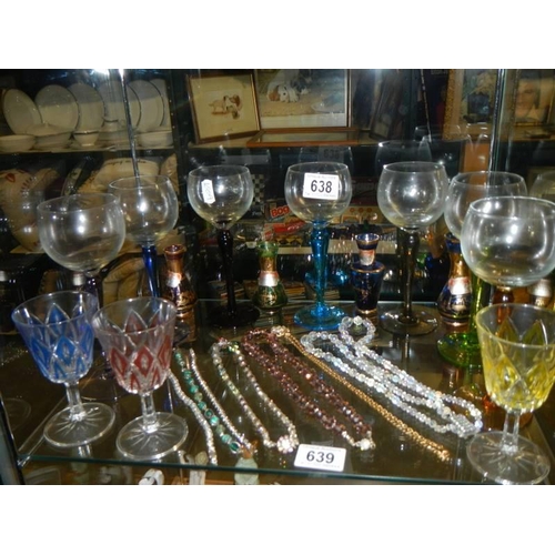 638 - A quantity of coloured glass drinking glasses and miniature vases.