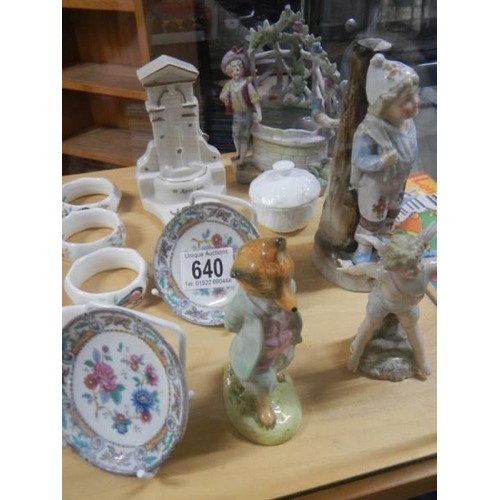 640 - A mixed lot of figures, napkin rings etc.,