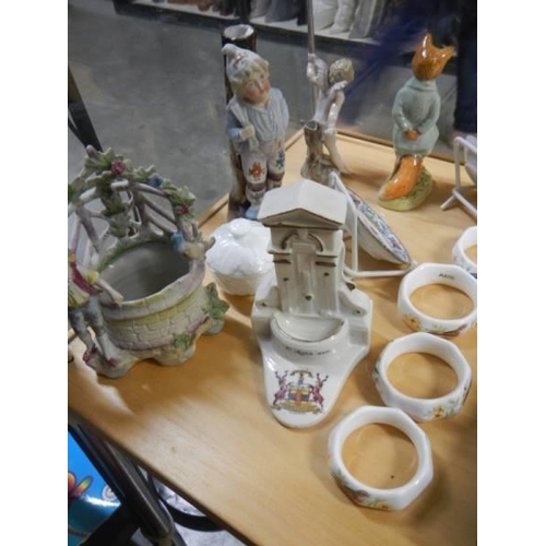 640 - A mixed lot of figures, napkin rings etc.,