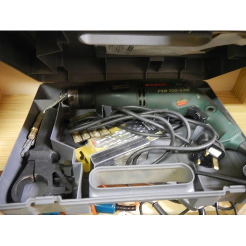 678 - A cased Bosch PSB 750-2 RE drill. COLLECT ONLY.