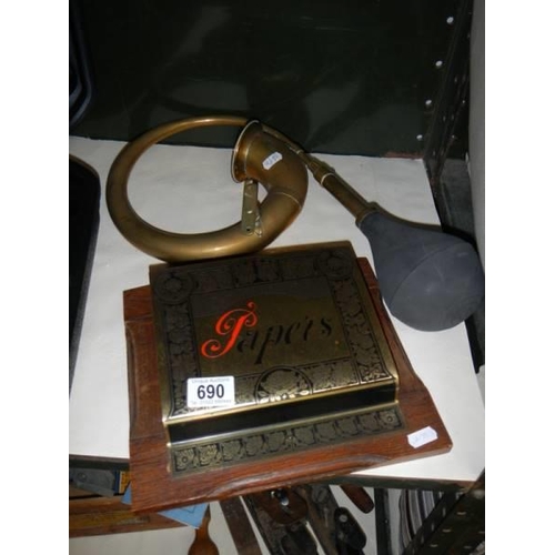 690 - A brass car horn and a brass letter rack.