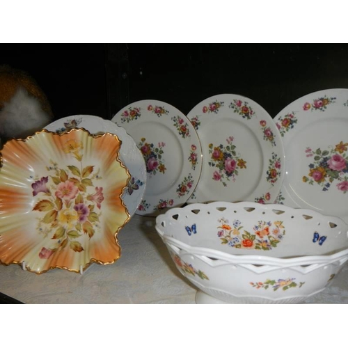 708 - A mixed lot of ceramic plates etc.,