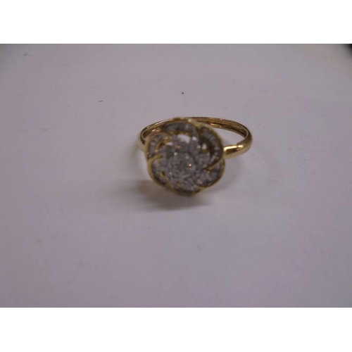 1018 - A yellow gold baguettes and brilliants diamond ring, size P.