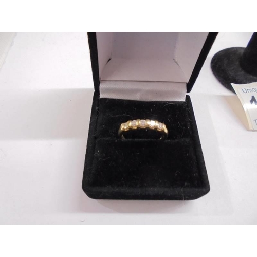 1022 - An 18ct yellow gold five stone diamond ring, size K.