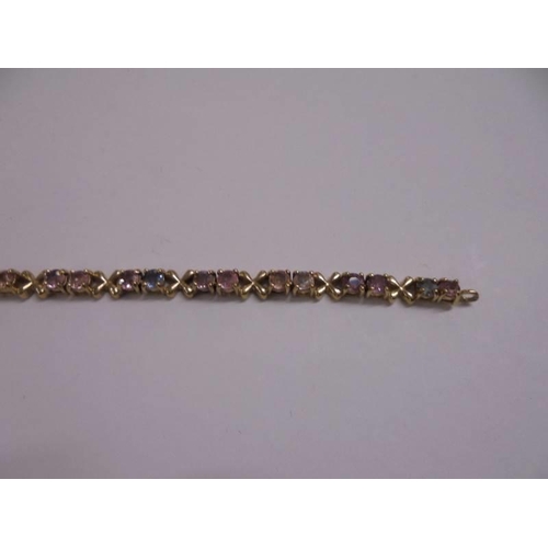 1028 - A yellow gold multi stone bracelet. 9 grams.