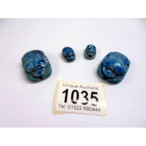 1035 - Four Egyptian turquoise scarab beetle seals/beads.