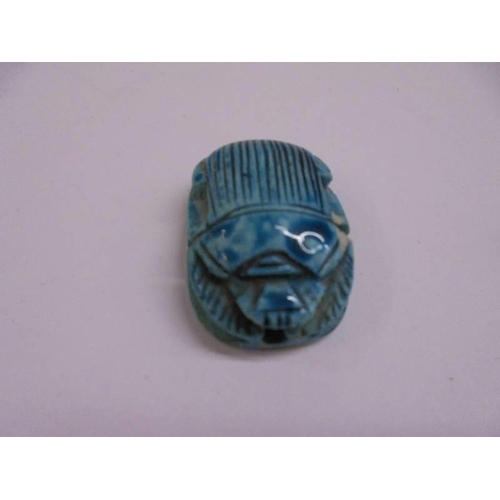 1035 - Four Egyptian turquoise scarab beetle seals/beads.