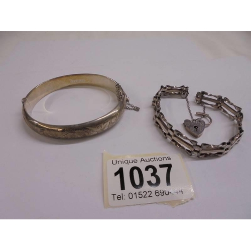 1037 - A silver gate bracelet with padlock and a silver bangle,