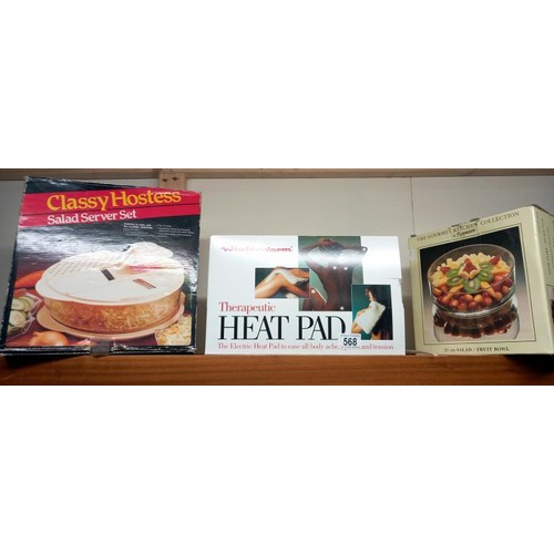 568 - A boxed heat pad, salad server set and fruit bowl.