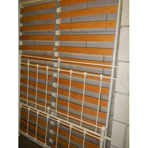 818 - A metal bedstead with slatted base, COLLECT ONLY.