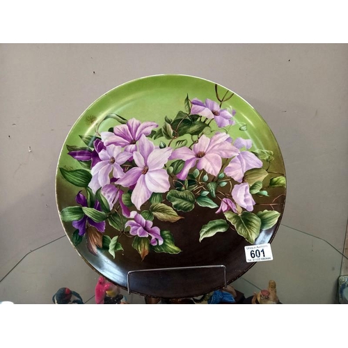 601 - A large floral wall/cabinet plate diameter 37cm