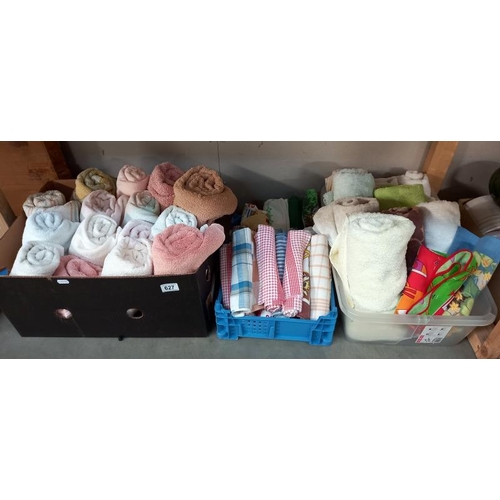 627 - 3 boxes of towels, tea towels, many of which are unused etc