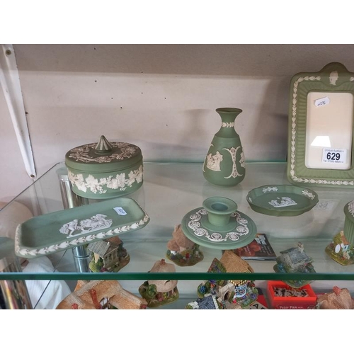 629 - A good collection of green Wedgwood Jasperware, including picture frame