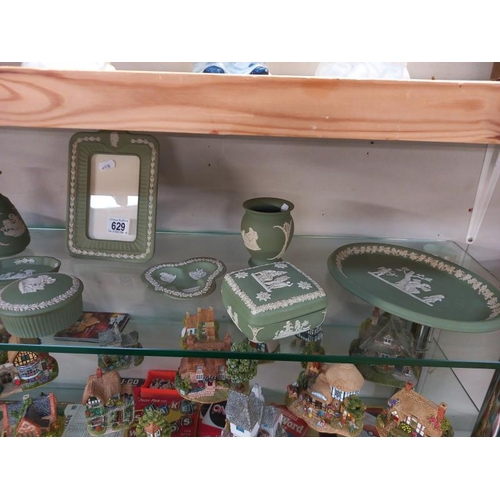 629 - A good collection of green Wedgwood Jasperware, including picture frame