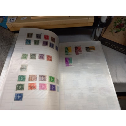 648 - 2 folders containing stamps