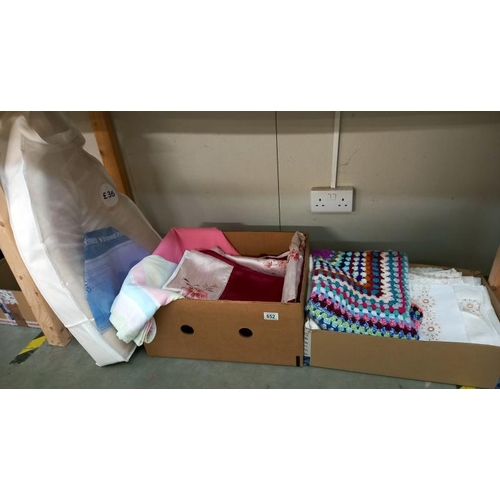 652 - 2 boxes of sheets, single duvet cover, crocheted blanket etc