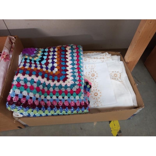 652 - 2 boxes of sheets, single duvet cover, crocheted blanket etc