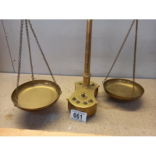 661 - A set of solid brass balance scales and weights with fish decoration