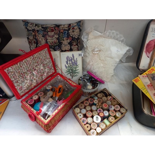 663 - A sewing box, box of cotton reels, box of buttons etc