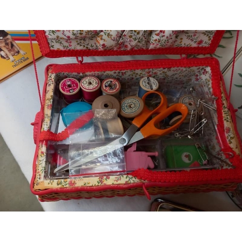 663 - A sewing box, box of cotton reels, box of buttons etc