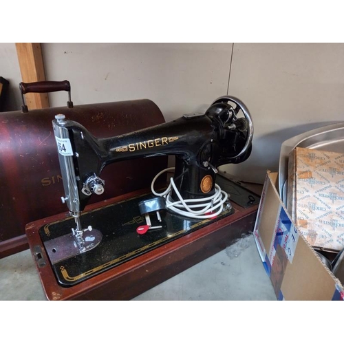 664 - A cased Singer sewing machine