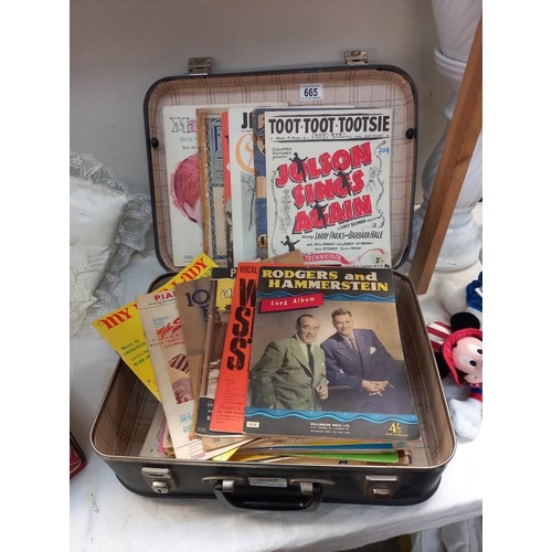 665 - A vintage suitcase containing a good lot of sheet music