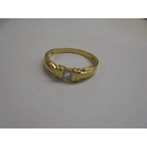 1046 - A Princess cut single stone diamond ring in 18ct gold, size N, 3.4 grams.