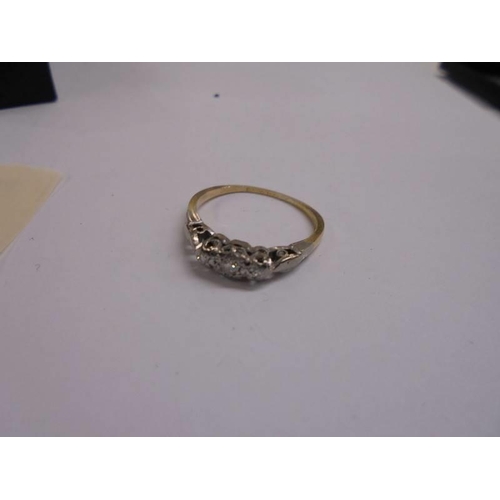 1054 - A vintage 3 stone diamond ring set in platinum, tested 18ct gold shank, circa 1940's, size K, 1.8 gr... 