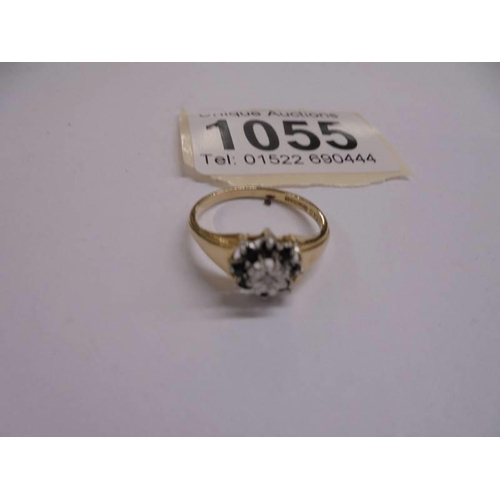 1055 - A diamond and sapphire cluster ring, dated Sheffield 1996, hall marked, size M half, 1.8 grams.