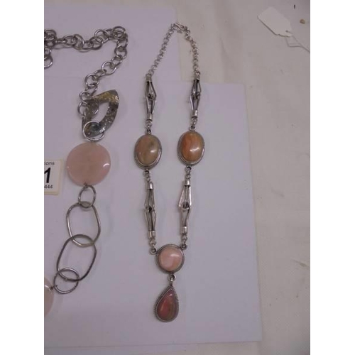 1061 - A rose quartz necklace together with another necklace.