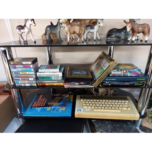 676 - A vintage Acorn electron computer with games (paintbox missing 1 cassette)