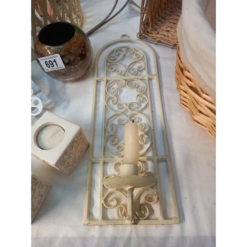 691 - A quantity of candle holders, a butterfly door hanger & shoppers basket etc.