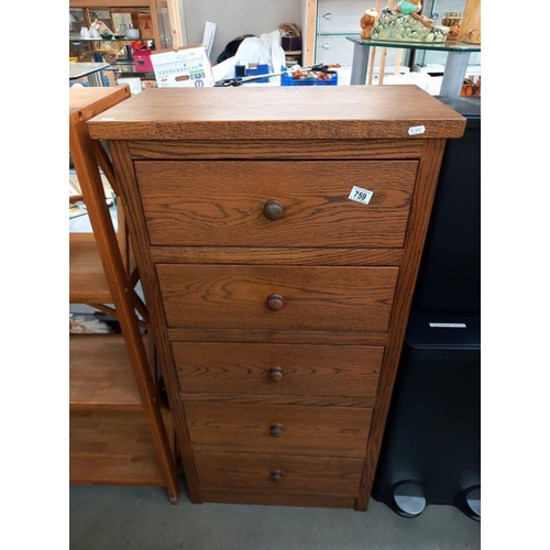 759 - A medium oak chest of drawers, 62cm x 34cm x 123cm