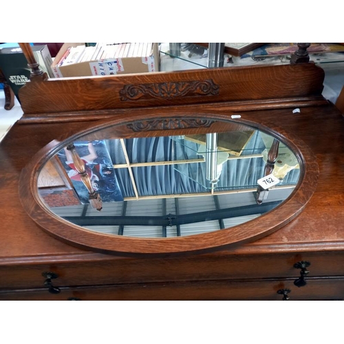 762 - An Edwardian oak dressing table, 1 mirror fixing A/F