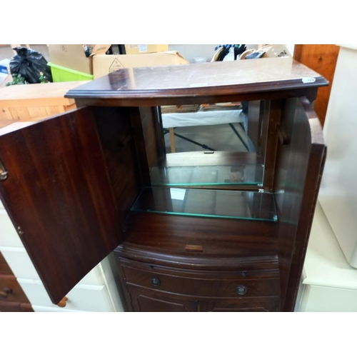 764 - A dark wood stained 4 door cabinet with drawer & writing shelf, 61cm x 43cm x 130cm high