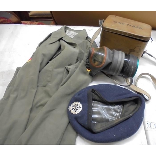 1191 - A RAF cap and jacket together with a gas mask.