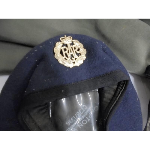 1191 - A RAF cap and jacket together with a gas mask.