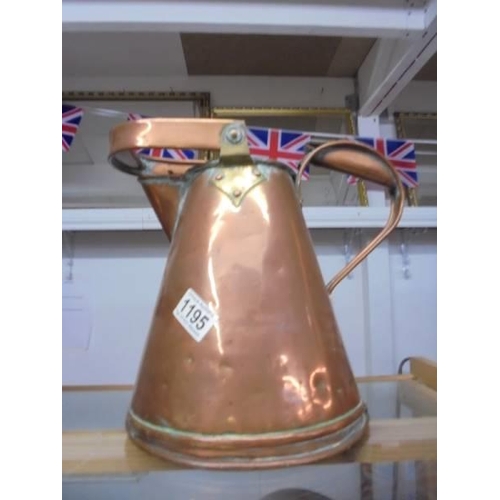 1195 - An antique eight pint copper jug.