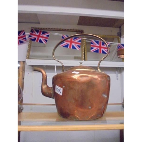 1196 - A large old copper kettle.