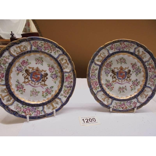 1200 - A pair of early Chinese hard paste porcelain plates with centre crests.