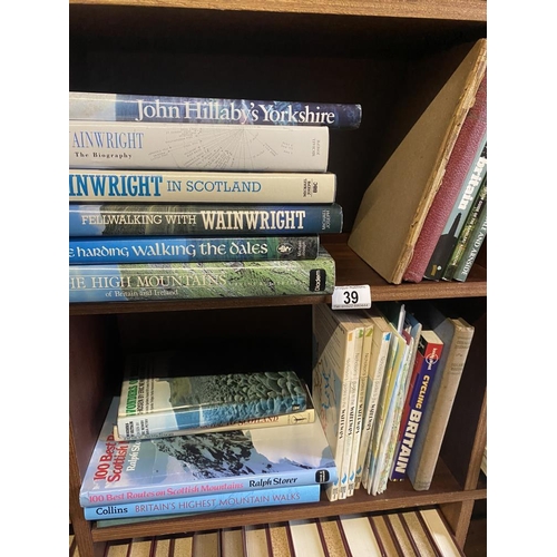 39 - A collection of walking & travel books including Wainwright (2 shelves)