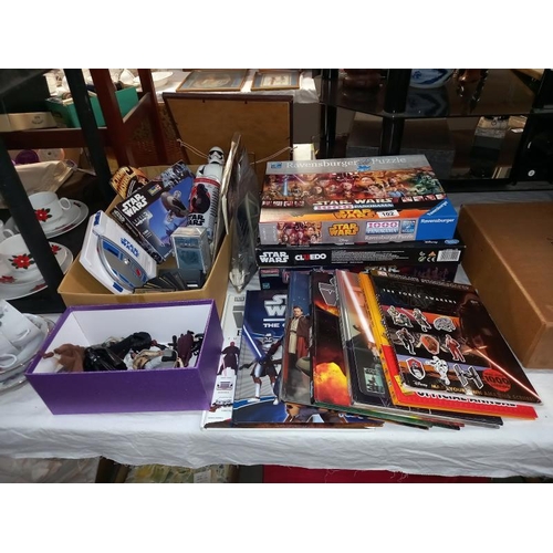 102 - A collection of Star Wars items including figures, cards, books & games including Monopoly & model k... 